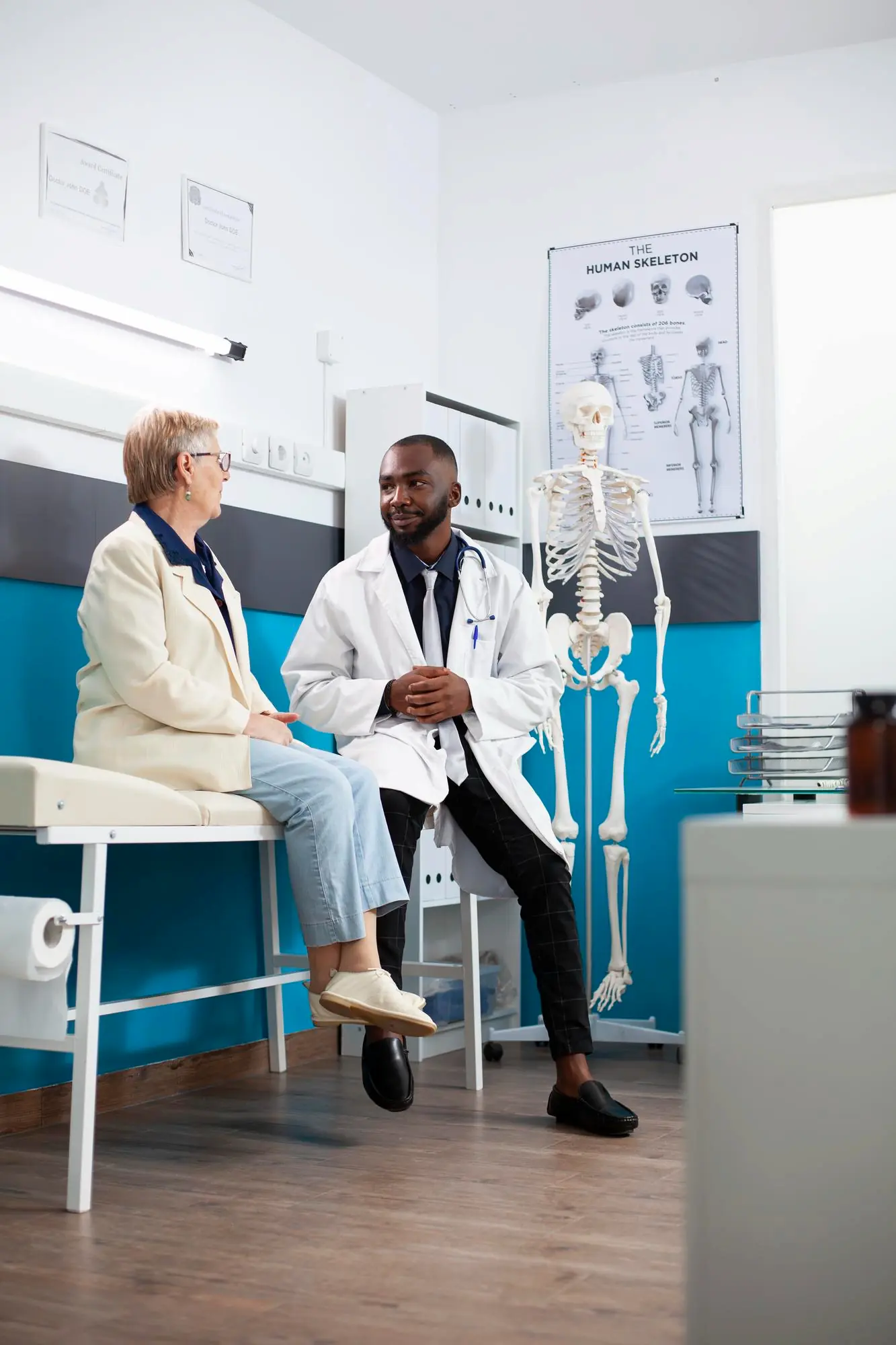 Doctor attends to old woman in hospital